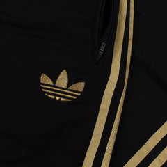 Adidas Firebird Trainingsanzug in Schwarz Gold Größe S